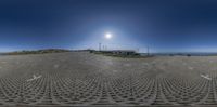 a large solar array that is in the middle of an open field with grass in it