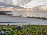 Portugal's Coastal Dawn: A Blend of Ocean and Gravel