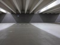 an indoor garage that is clean and empty of people or cars to see them in