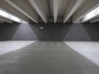 an indoor garage that is clean and empty of people or cars to see them in