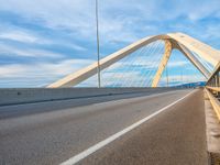 a bridge that is across from another bridge and has some lines going down it and there is no clouds on the sky