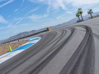 Race Track: Asphalt and Clouds