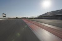 Race Track: Automobiles in Motion Blur