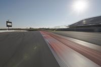 Race Track: Automobiles in Motion Blur