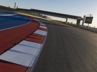 Race Track: A Car's POV Under Clear Skies