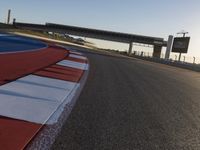 Race Track: A Car's POV Under Clear Skies