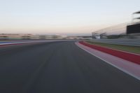 POV Racing: Motion Blur Straight Down the Road on a Race Track