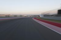 POV Racing: Motion Blur Straight Down the Road on a Race Track