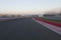 POV Racing: Motion Blur Straight Down the Road on a Race Track