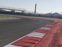a racing track with many ramps in it and cars around them and a sky background