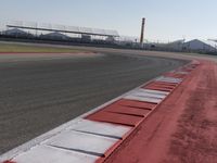 a racing track with many ramps in it and cars around them and a sky background