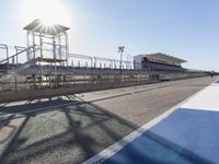 Race Track Road with Clear Sky and Sun