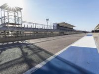 Race Track Road with Clear Sky and Sun