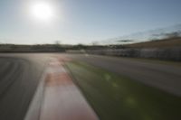 Race Track Days: Sun Visible against a Clear Sky