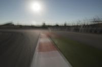 Race Track Days: Sun Visible against a Clear Sky