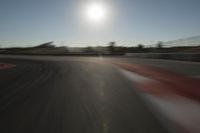 Race Track Days: Sun Visible against a Clear Sky