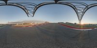 the time lapse is shown from inside the terminal's glass windows showing a track with cars and trucks