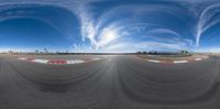 a fisheye lens view of a race track with a very long, curved strip