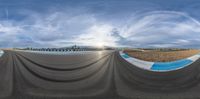 fish eye view of track course on cloudy day in mountainside area in desert area