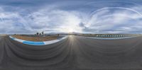 a view from inside a fish eye lens of the racing track that has a turn