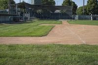 there are two baseball fields in the picture on this day and a batter's box