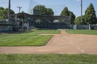 there are two baseball fields in the picture on this day and a batter's box