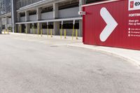 a sign for exit point of entrance in an industrial building parking area where to pick up the door