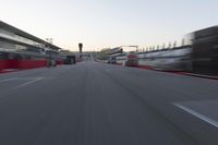 Red Race Car Speeding Down the Road