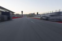 Red Race Car Speeding Down the Road