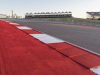 Red Race Car Speeding on Race Track