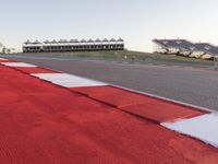 Red Race Car Speeding on Race Track