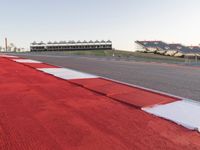 Red Race Car Speeding on Race Track