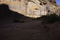 rocks and desert in the background in the foreground, with no vegetation or people sitting at the end