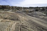 the road to the top of the rock formation is curved and winding up to the top of the hill