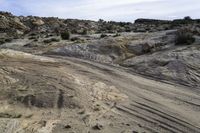 the road to the top of the rock formation is curved and winding up to the top of the hill