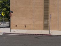 a red stop sign sitting in front of a wall with two brown fire hydrants