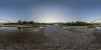 the reflection of two bridges is captured on this 360 - zoom shot of the area