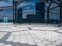 the reflection of buildings from inside of the glassed building in the city, shows off the architecture