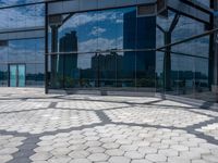 the reflection of buildings from inside of the glassed building in the city, shows off the architecture