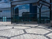 the reflection of buildings from inside of the glassed building in the city, shows off the architecture