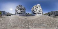 a 360 - shot of some buildings and street cars in the same position of view