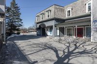 the vacant buildings and walkway are empty in a small town street in new england, united states