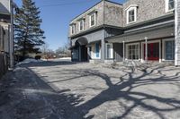 the vacant buildings and walkway are empty in a small town street in new england, united states