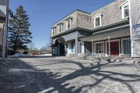 the vacant buildings and walkway are empty in a small town street in new england, united states