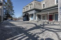 the vacant buildings and walkway are empty in a small town street in new england, united states