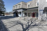 the vacant buildings and walkway are empty in a small town street in new england, united states