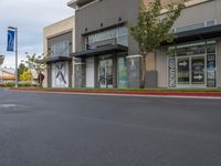 a road is empty at a retail store in this neighborhood's urban area of an outside business