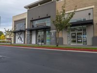 a road is empty at a retail store in this neighborhood's urban area of an outside business