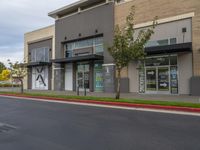 a road is empty at a retail store in this neighborhood's urban area of an outside business