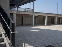 the empty parking lot is full of concrete pillars and balks, but only one person in it